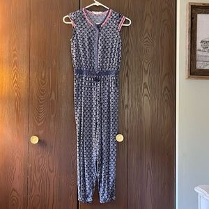 H&M navy blue with white circles with neon pink trim jumpsuit. Size 8/9 Y